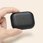 The case held between finger and thumb, showing its size