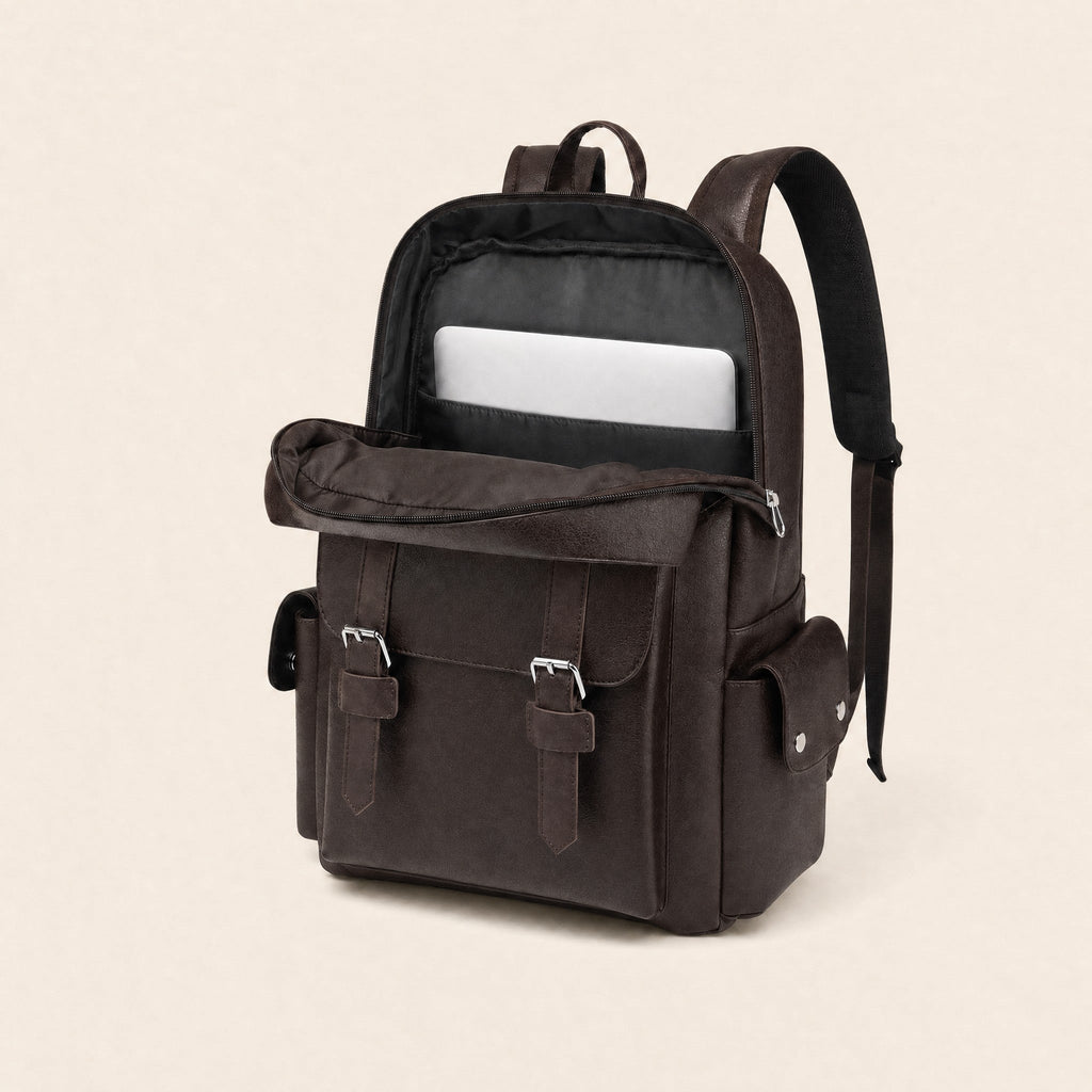 Dark brown leather backpack open, showing padded laptop sleeve