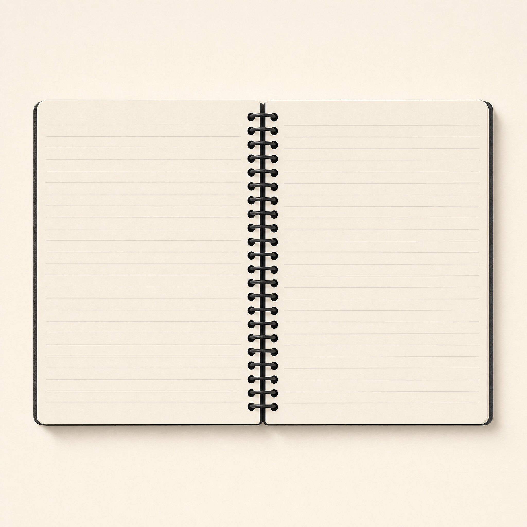 Spiral notebook open flat, showing the lined pages