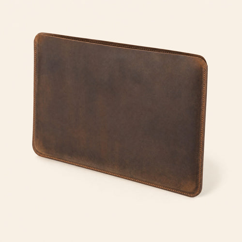 Dark brown leather laptop sleeve, three-quarter view