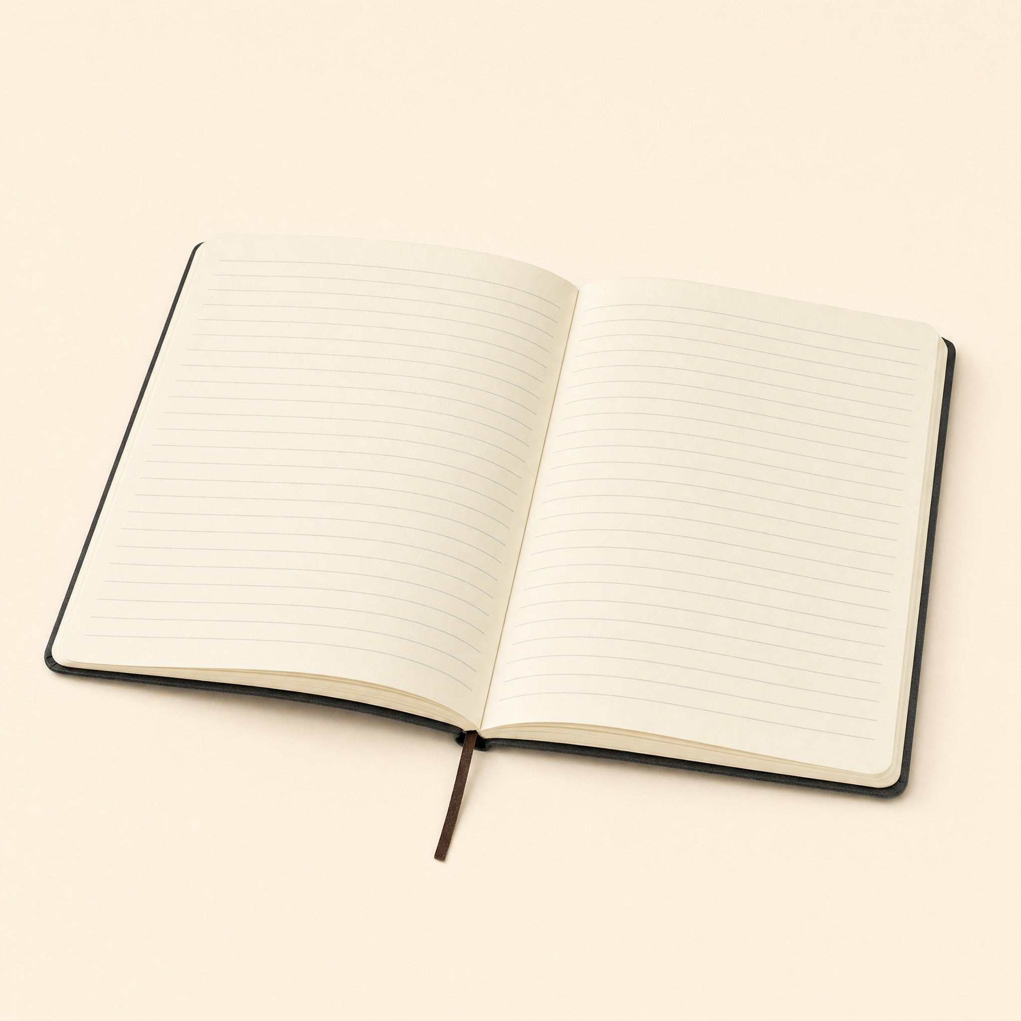 The notebook open, showing the cream ruled pages