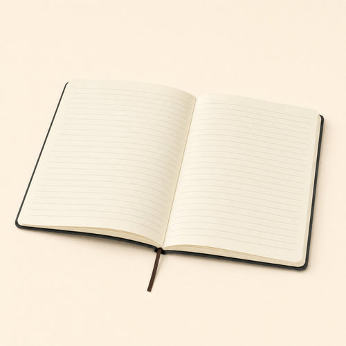 The notebook open, showing the cream ruled pages